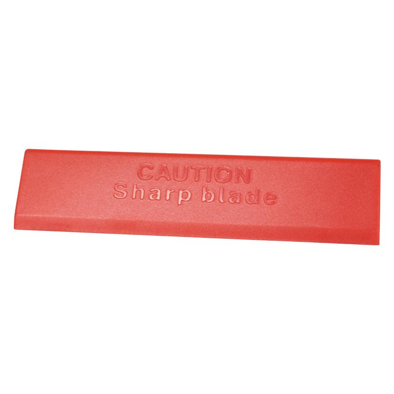 Red plastic safety blade cover embossed with 'CAUTION Sharp blade' to warn of a sharp blade underneath