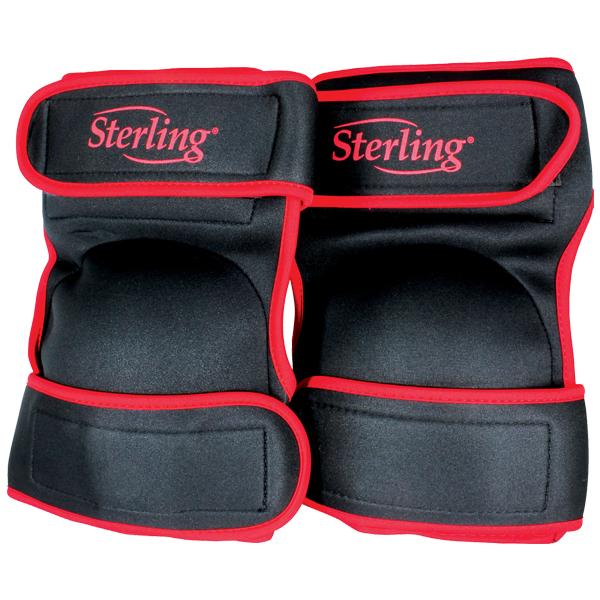 Pair of black and red Sterling wrist guards with Velcro straps, designed to protect wrists during skating.