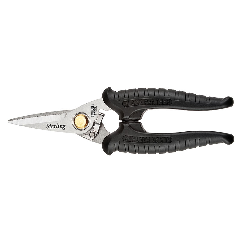 Black-handled pruning shears with stainless steel blades, used for trimming plants in a garden setup.