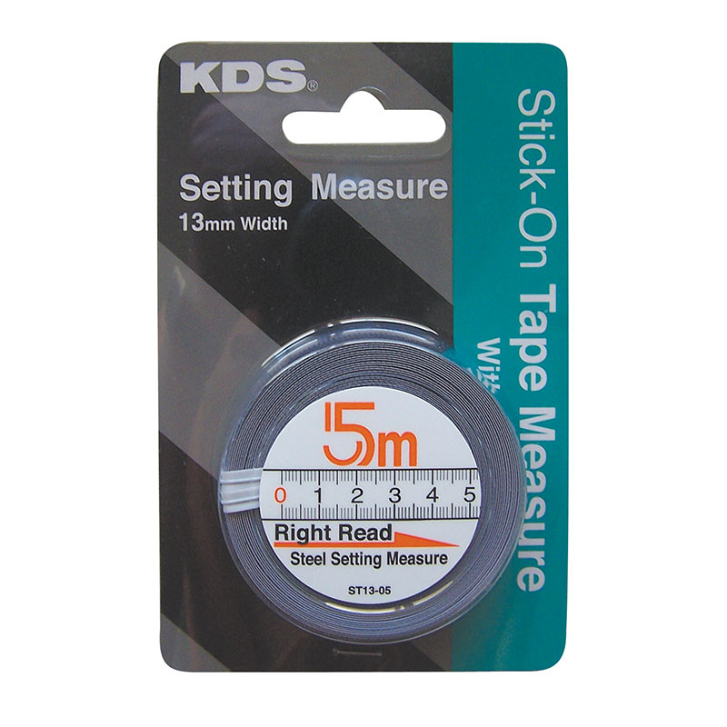 KDS Stik-On Tape Measure in blister pack with a 5 m steel tape and ruler visible on the dialed scale, 13 mm width paneling shown in background.